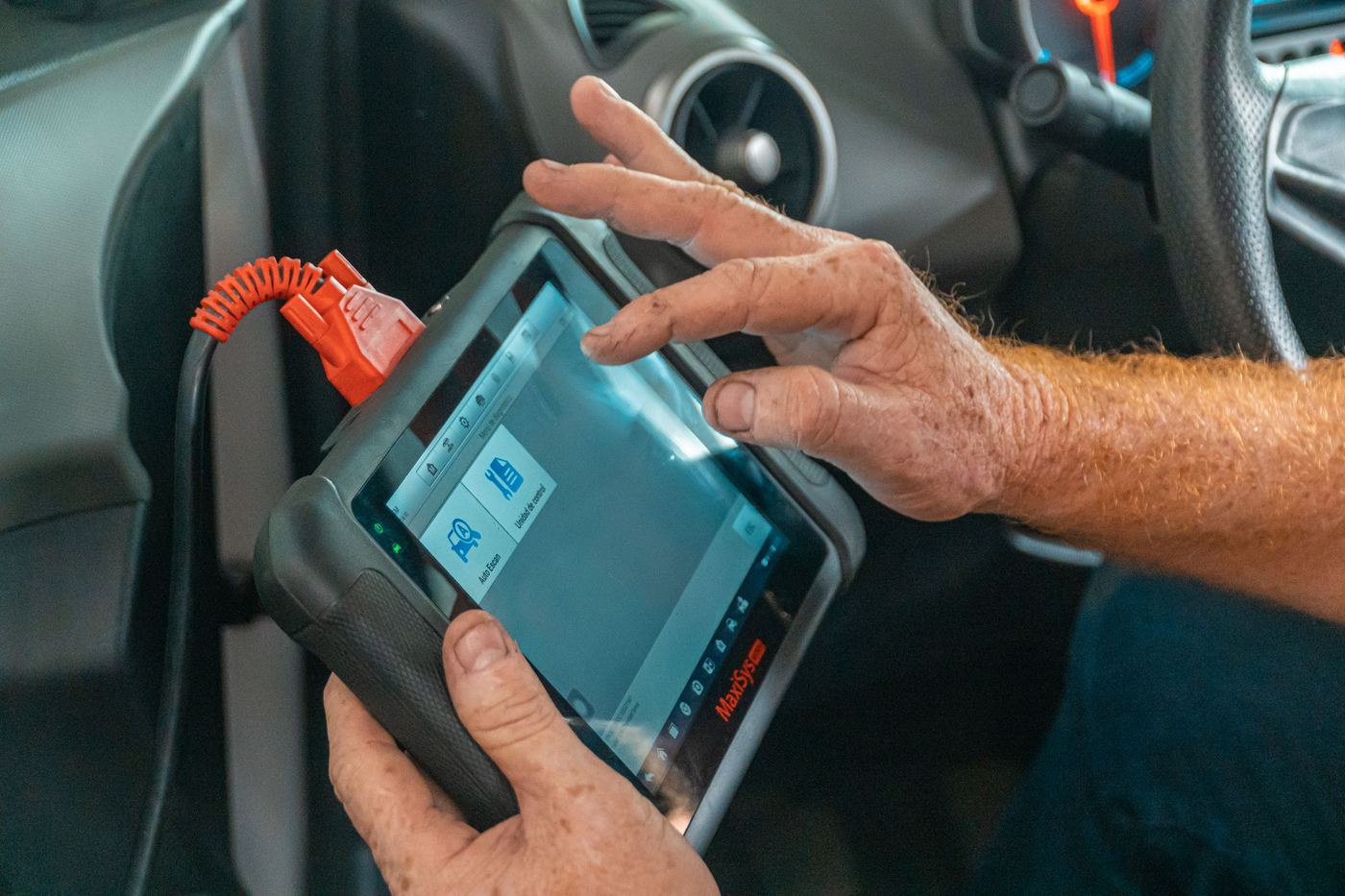 Diagnostic tool plugged into the OBD port